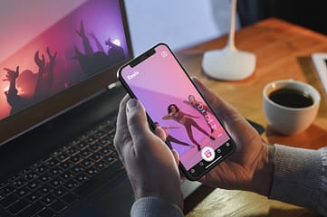 high-angle-hands-holding-smartphone Why Your Business Needs Instagram Reels