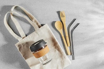 set-eco-friendly-bamboo-cutlery-eco-bag-reusable-coffee-mug-sustainable-lifestyle-plastic-free-concept_479776-1905 goodie bag